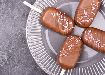 Ice cream in chocolate on a stick