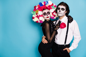 Photo of spooky tender couple man lady girl cuddle wait festival vehicle transport dead people only wear black dress death costume roses headband suspenders isolated blue color background