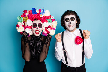 Photo of scary two people man lady surprised raise fists win undead role play character competition...