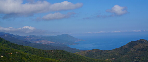 Fototapeta na wymiar panoramic view of the mountains with blue sky