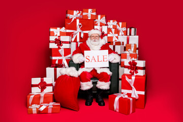Full length body size view of his he nice handsome cheery Santa sit in chair holding in hand sale...