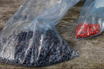 A bag of freshly picked blueberries and lingonberries.