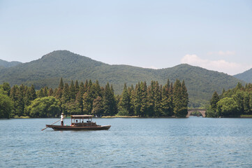 Fototapeta na wymiar Rowing boat on West Lake, Hangzhou, China