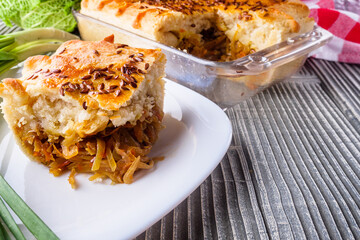 freshly baked cabbage pie on rustic wooden background