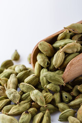 fragrant green cardamom on a white acrylic background