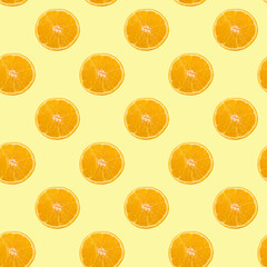 A pattern of sliced orange circles on a yellow background.