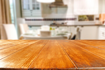 Desk of free space and blurred kitchen interior 