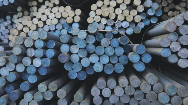 Warehouse of metal billets at the factory, round metal blank, metal blank.