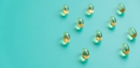 Fish oil capsules on a blue background. Omega-3