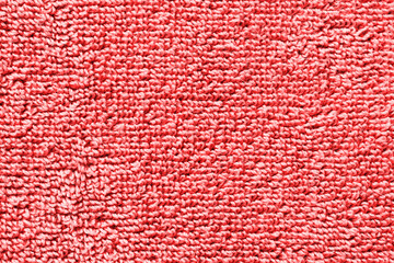 Red towel texture. Macro fiber pattern. Soft cotton textile material background. Absorbent fluffy cloth.