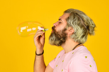 Good vibes. Blow inflate bubbles. Forever young guy. Positive. Carefree man soap bubbles. Summer...
