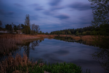 Fototapeta premium sunset evening view on lake in Stradch, Lviv district. june 2020. Long exposure shot.