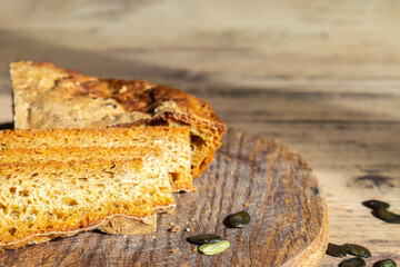 Fresh baked pumpkin bread on cutting board