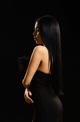 Fototapeta premium Elegant sexy woman. Black Friday advertising. beauty salon for real woman. Portrait of young woman in black dress. wearing dress for special occasion. attractive glamour girl. girl black background