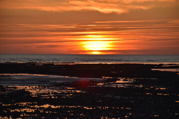 Yellow, orange, blue  sunset in the beach.