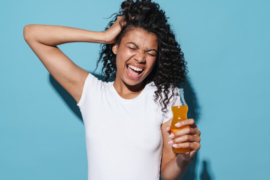 Image Of Excited African American Screaming While Drinking Soda