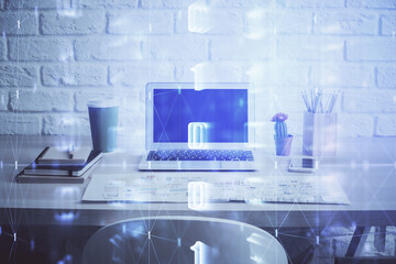 Double exposure of desktop computer and technology theme hologram. Concept of software development.