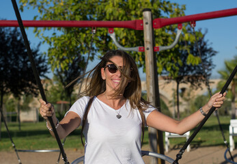 Attractive Funny Girl Swinging On A Swing.
Lifestyle