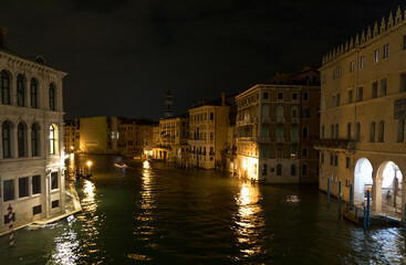 Nightly scene overlooking some palaces on a canal in Venice