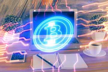 Multi exposure of blockchain theme hologram and table with computer background. Concept of bitcoin...