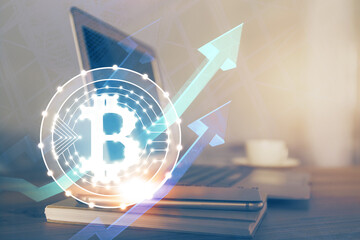 Multi exposure of blockchain theme hologram and table with computer background. Concept of bitcoin...