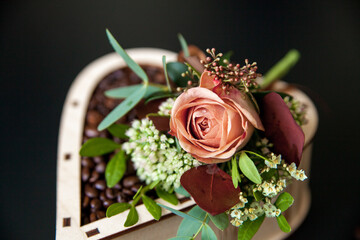 Wedding boutonniere for the groom and decorative wooden coffee box