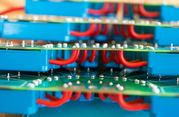 Close-up of a large green microcircuit with blue components