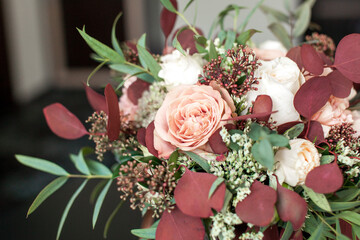 Wedding bouquet of flowers from white red rosebuds