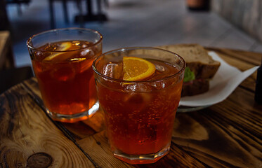 appetizer spritz cocktails on rustic timber with sandwich