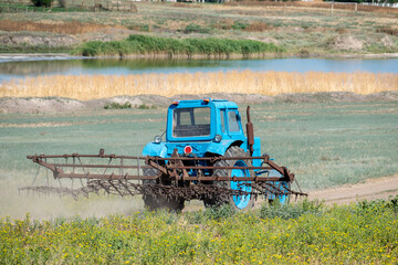 Old tractor with harrow
