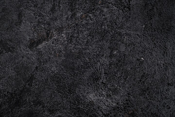 Black texture of volcanic stone surface