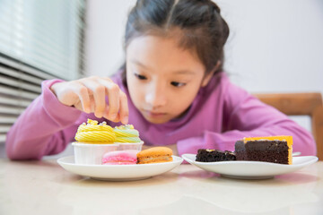 Little asian girl enjoy eating cake, Slow-motion