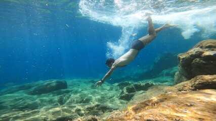 young man snorkelling in costa brava