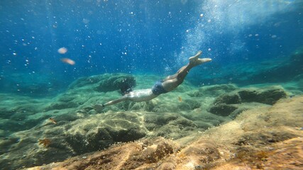 Fototapeta na wymiar young man snorkelling in costa brava