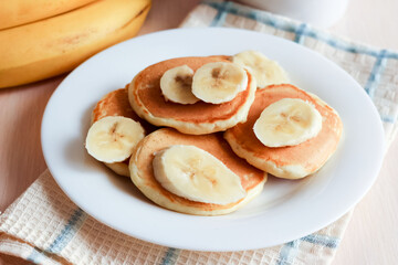 pancakes on milk with banana. Breakfast time