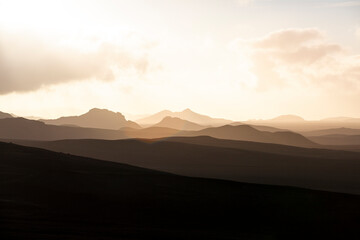 Highlands - Iceland - Golden sunset in the silhouette mountains