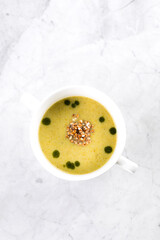 Peas soup on rmarble table, background, top view, copy space