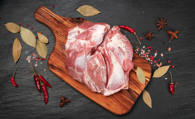 Fresh raw beef steak on black stone background