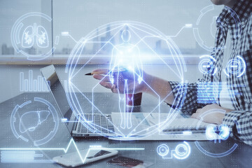 Science hologram with man working on computer on background. Concept of study. Double exposure.