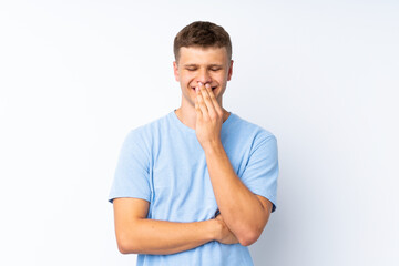 Young handsome man over isolated white background smiling a lot