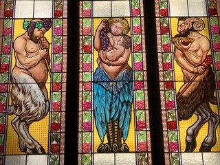 Obraz na płótnie Canvas Close up view stained glass featuring a woman holding baby 