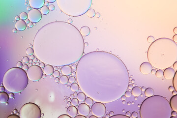 Colorful artistic of oil drop floating on the water. Abstract pastel bubble background.