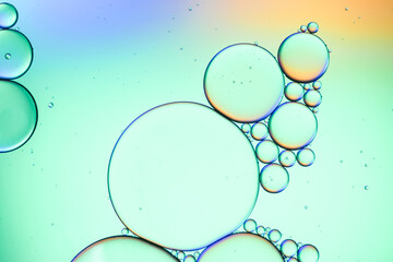 Colorful artistic of oil drop floating on the water. Abstract bubble background.