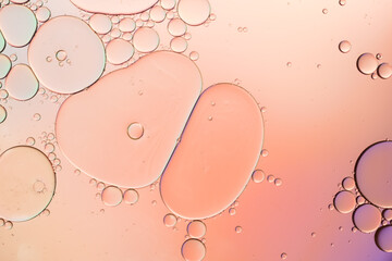Colorful artistic of oil drop floating on the water. Abstract pastel bubble background.