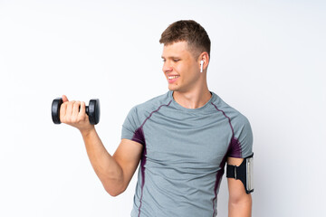 Young sport man with weightlifting over isolated white wall with happy expression