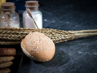 Bread and baking ingredients placed on kitchen table before preparing bread dough, kneading the dough, food homemade bakery concept