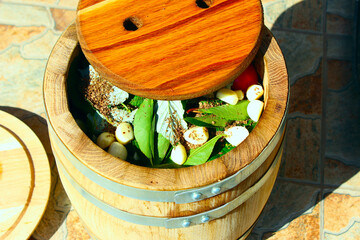 barrel filled with vegetables