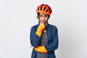 Young cyclist woman isolated on white background thinking