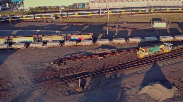 Aerial Over A Rail and Freight Yard With Containers In Transit, Auckland, New Zealand