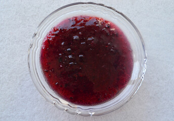 Red and black currant jam for tea brewing.